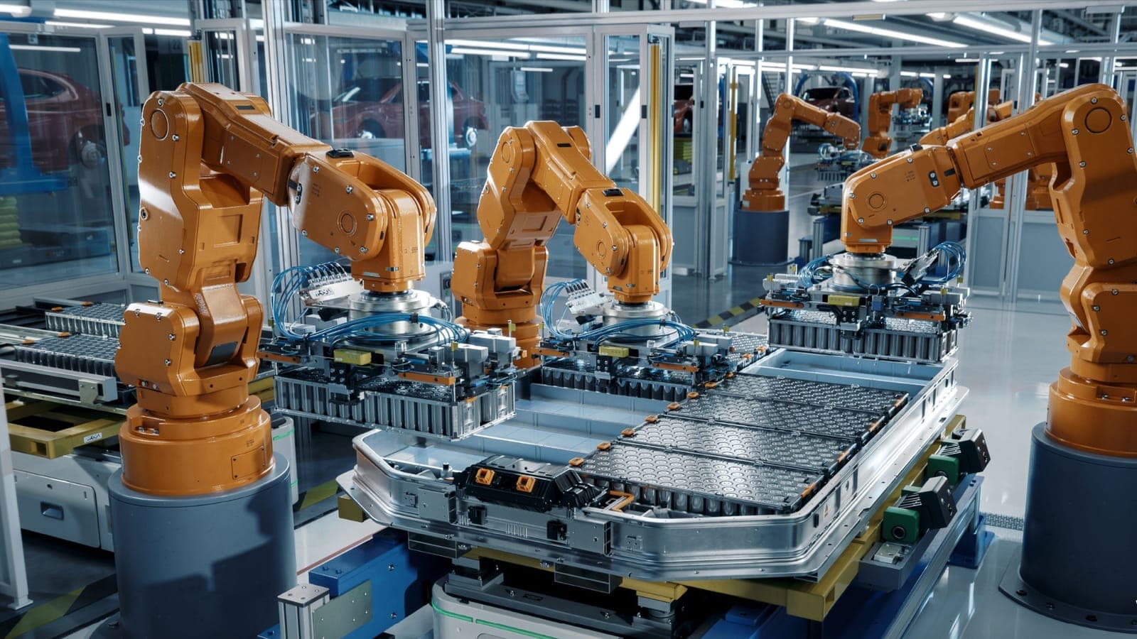 Robotic arms on an automated assembly line